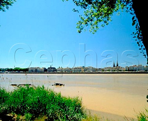 Quai de Chartrons and the river Garonne with the   Chartrons quarter and spires of StLouis church   behind  Bordeaux Gironde France
