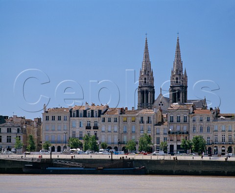 Quai de Chartrons and the river Garonne with the   Chartrons quarter and spires of StLouis church   behind  Bordeaux Gironde France
