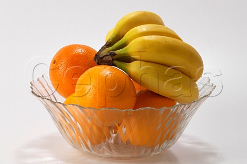 Fruit bowl with oranges and bananas