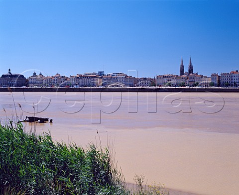 Quai des Chartrons and the river Garonne with the  Chartrons quarter and spires of StLouis church  behind  Bordeaux Gironde France