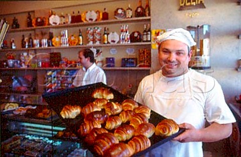 Chef holding tray of croissants    Lisbon Portugal