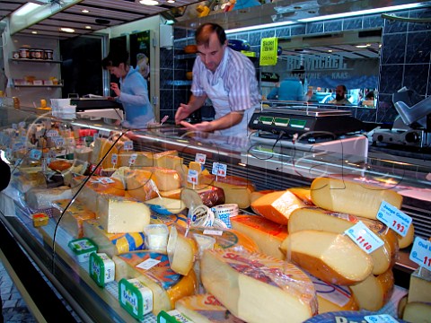 Cheese stall in Brugge Saturday market Belgium