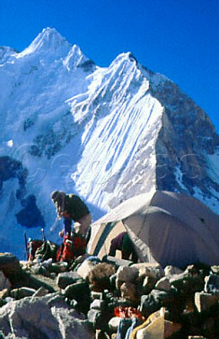 Climber and tent above Ali Camp on the   Vigne Glacier in the Karakoram Range   Pakistan
