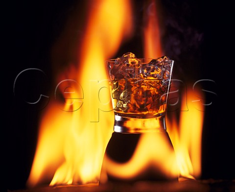 Whisky glass and flames