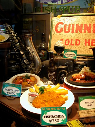 Plastic models of food in a window display outside   an Irish pub in the Shinjuku district of Tokyo Japan