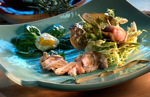 Quail salad with egg and spinach