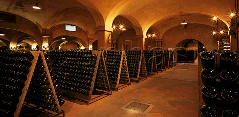 Pupitres of sparkling wine in the cellars of   Bellavista Erbusco Lombardy Italy      Franciacorta