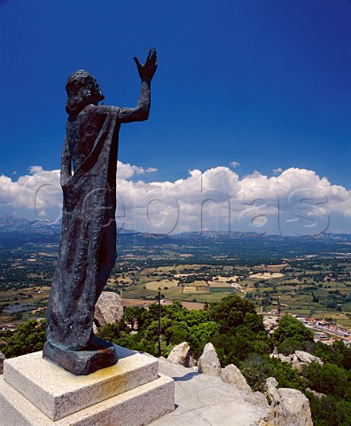 Statue of Jesus on the viewpoint above the wine town of Monti Sardinia Italy
