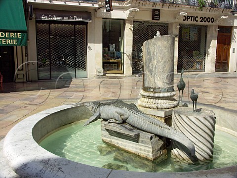Statue of crocodile used as the citys emblem in   the Place du Marche Nmes Gard France   LanguedocRoussillon