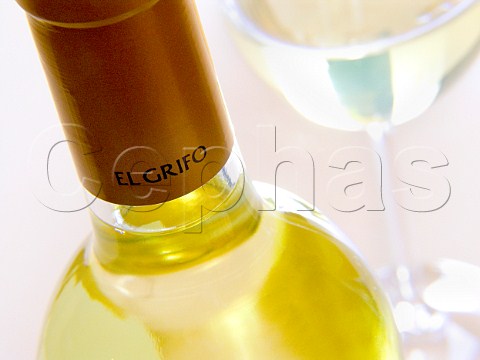 Bottle neck of El Grifo Malvasia Seco wine glass in   background Lanzarote Canary Islands Spain   Lanzarote