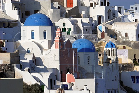 Blue domed churches in village of Ia Santorini   Cyclades Islands Greece