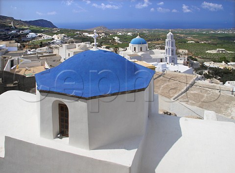 Bluedomed churches in the hilltop village of   Pirgos Santorini Cyclades Islands Greece
