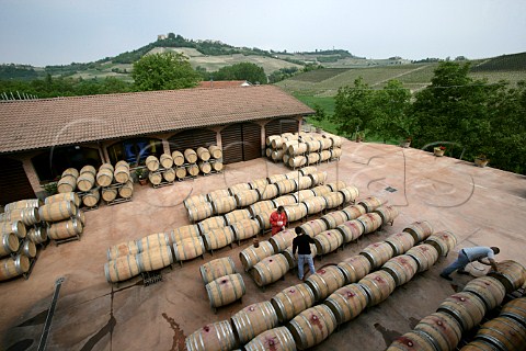 Filling barriques with Nebbiolo in courtyard of   Domenico Clerico winery Monforte dAlba Piemonte   Italy