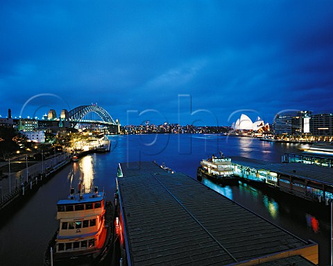 Circular Quay Harbour Bridge and Opera House at   dusk   Sydney New South Wales Australia