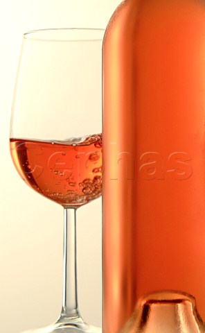 Glass and bottle of ros wine
