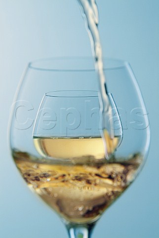 Pouring glasses of white wine