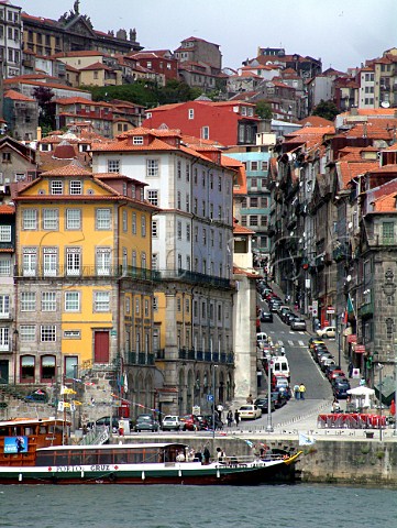 View from the quayside of Vila Nova de Gaia towards   Praa da  Ribeira and the steep winding streets of   the old town in Porto The yellow building in the   foreground is the Pestana Porto Hotel Porto    Portugal