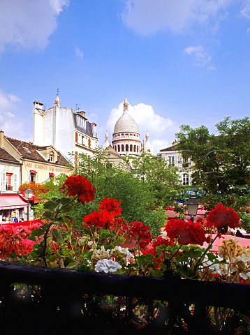 View of the dome of Sacre Coeur Cathedral in   springtime seen across Place du Tertre Montmartre   Paris France