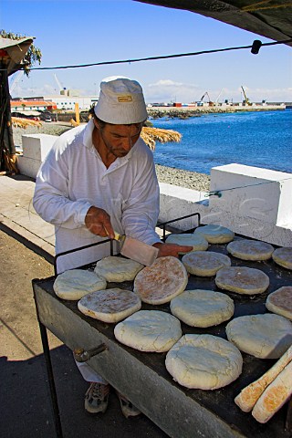 Preparing bread cakes during a festival at Canial  Madeira Portugal