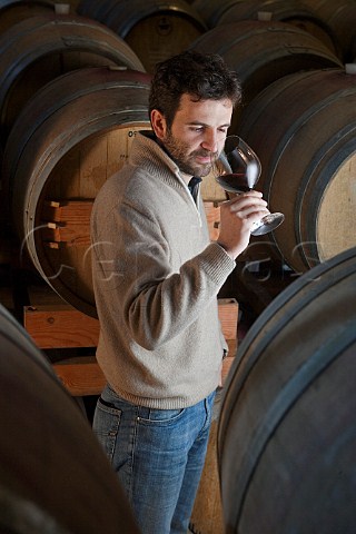 Silvano Boroli tasting in barrel cellar of Vini   Boroli Madonna di Como near Alba Piemonte Italy