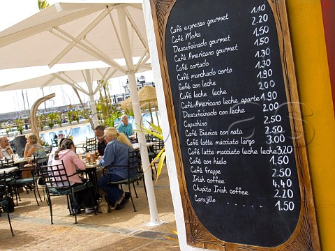 Menu board displaying variety of coffees available  at a waterside caf in Marina Rubicon Lanzarote Canary Islands
