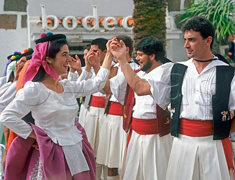 Canary dancers in traditional costume perform   outside the bodega in Pueblo Canario Las Palmas de   Gran Canaria Spain