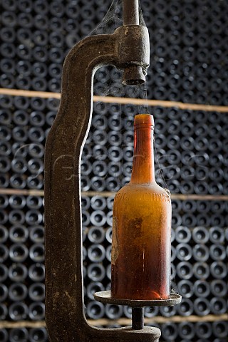 Antique corking machine in the cellar museum of   Giacomo Borgogno Barolo Piedmont Italy  Barolo