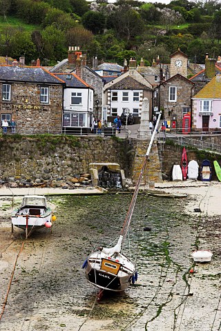 Low tide in the harbour at Mousehole Cornwall   England
