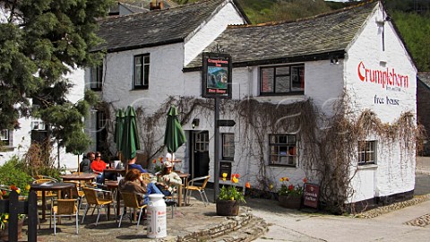 People drinking outside the Crumplehorn Inn   Polperro Cornwall England