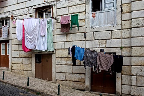 Laundry hanging in a narrow street  Alfama Old   Lisbon Portugal