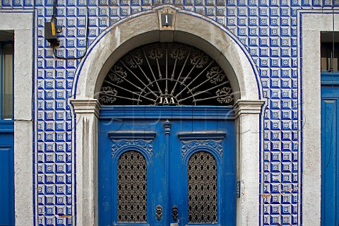 Traditional azulejos blue tiles surrounding doorway   Alfama Old Lisbon Portugal