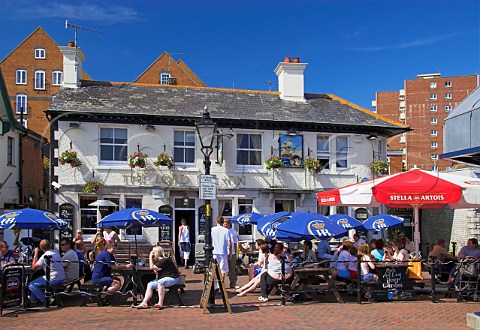 People drinking outside the Lord Nelson public   house Poole Dorset England