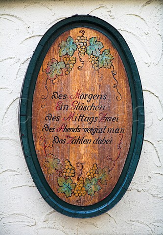 Barrel end decoration outside Weingut Martin Mllen with a poem saying In Mornings one small glass lunchtimes two in evenings we forget how to count   thereby TrabenTrarbach Germany  Mosel