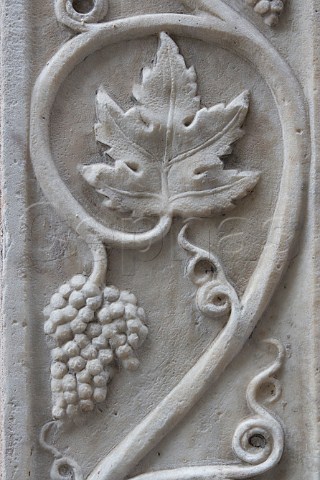 Grapevine relief on house in the old quarter of   Savona Liguria Italy