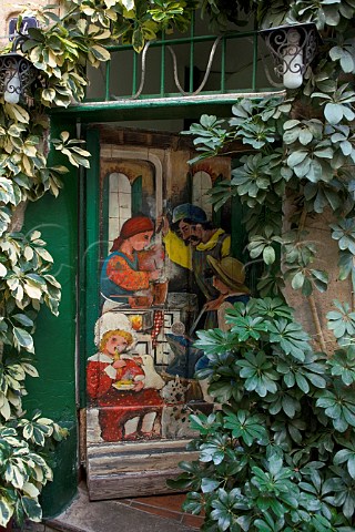 Painted mural on restaurant door on Via Demaestri   Sportorno Liguria Italy