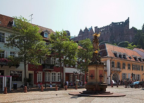 Statue of Madonna and Child in the Kornmarkt with   Heidelberg castle beyond  Heidelberg   BadenWrttemberg Germany