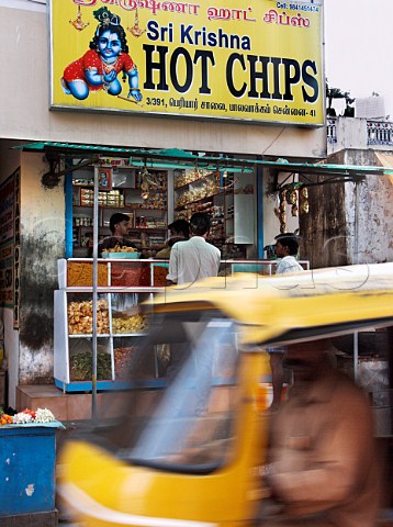 Traffic passing in front of Sri Krishna Hot Chips   shop Chennai Madras India