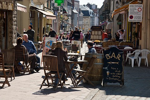 Terrace tables outside the many cafs and   restaurants on Rue de Lille in the old quarter of   Boulogne PasdeCalais France
