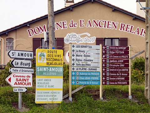 Mass of direction signs at road junction on the   Route des Vins near StAmour SaneetLoire France   SaintAmour  Beaujolais