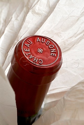 Capsule on tissue wrapped bottle of Chteau Ausone   Saintmilion Gironde France Stmilion    Bordeaux