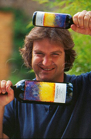 Bibi Graetz with bottles of his Testamatta wine Fiesole Tuscany Italy  Chianti Colli Fiorentini
