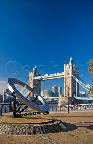 Sundial at St Katharines Dock with Tower Bridge behind London