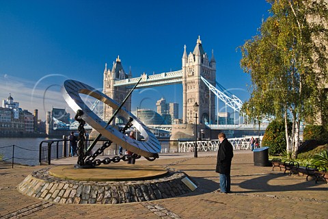 Sundial at St Katharines Dock with Tower Bridge behind London