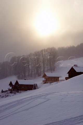 Sunset over chalets in the ski resort of Le Chinaillon Le GrandBornand HauteSavoie France