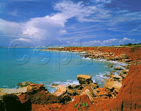 Red pindan soil rocks and turquoise sea at Gantheaume Point Broome Western Australia