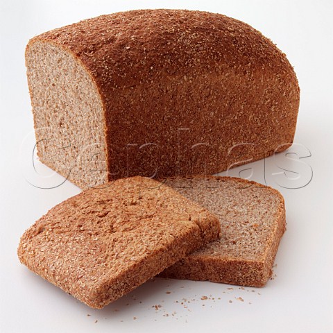 A wholewheat loaf with two slices