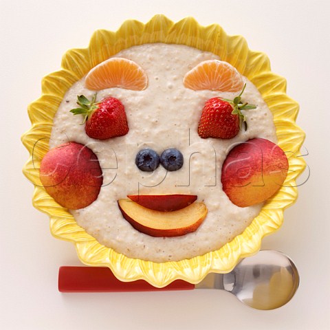 Porridge with fresh fruit made into a funny face