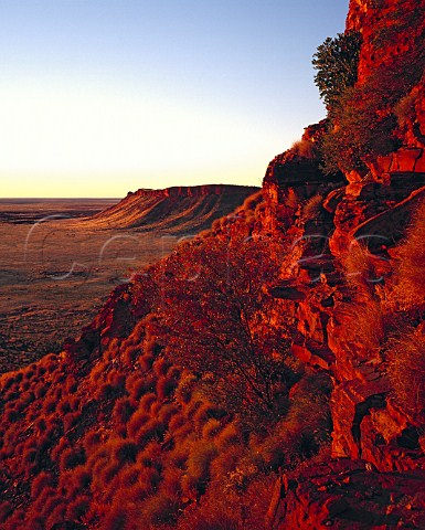 Red sunset light on the western escarpment of the Breadon Hills near Well 48 on the Canning Stock Route Great Sandy Desert Western Australia