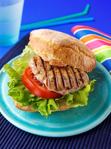 Chicken burger with salad in a roll