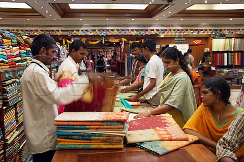 People looking at sarees in Pothys textile store Panagal Park Chennai MadrasTamil Nadu India